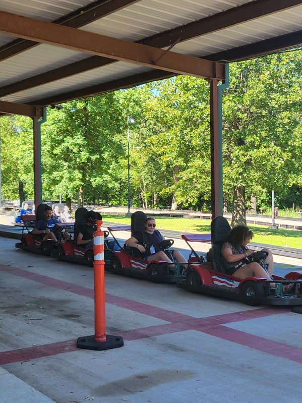 Youth group riding go-karts