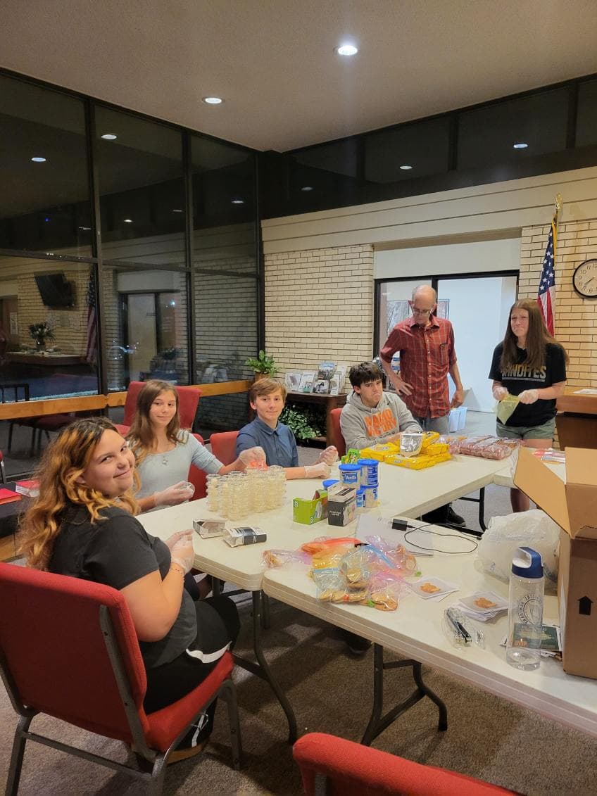 Youth group packing mission bags